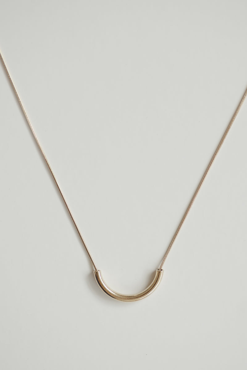 Clair de Lune gold crescent necklace on a 14k plated snake chain