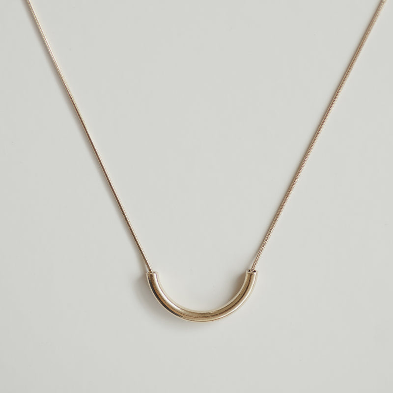 Clair de Lune gold crescent necklace on a 14k plated snake chain