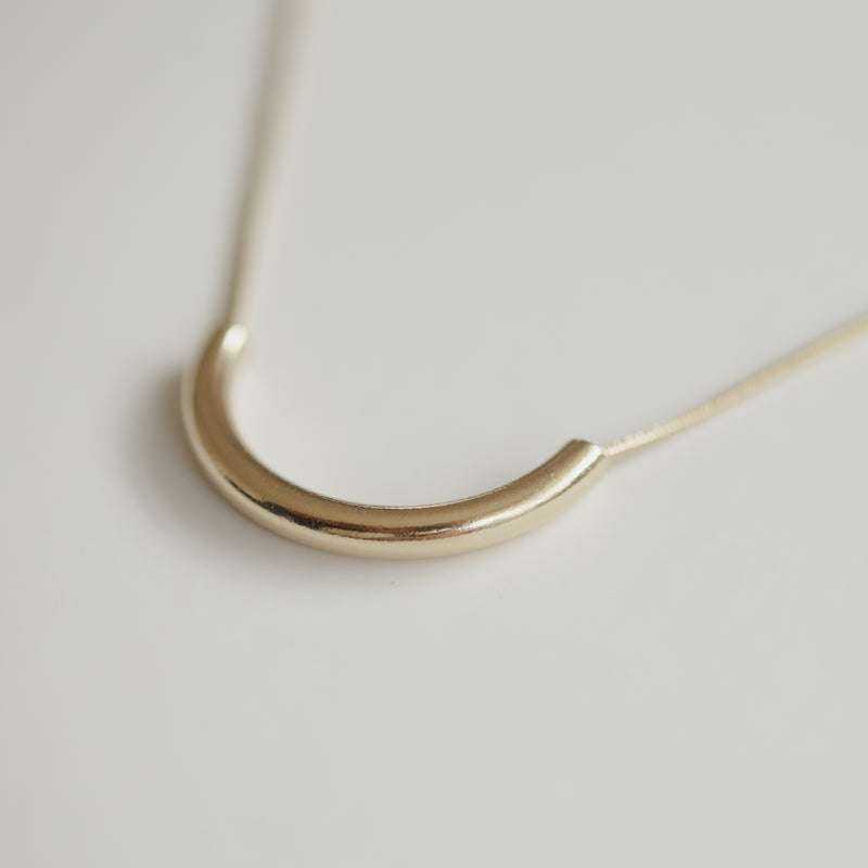 Clair de Lune gold crescent necklace on a 14k plated snake chain