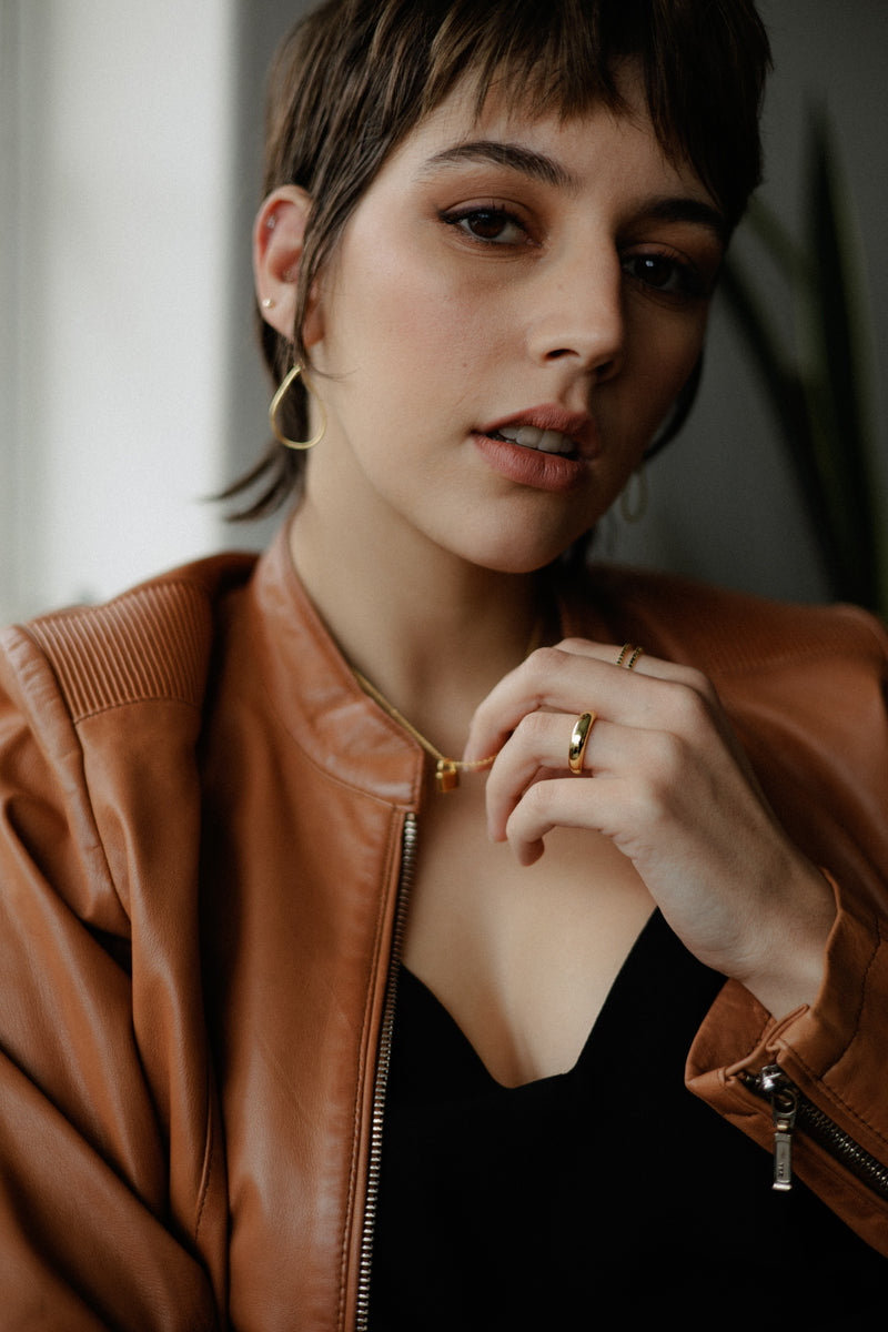 Erika ring – 14k gold plated sterling silver band on dark textured background