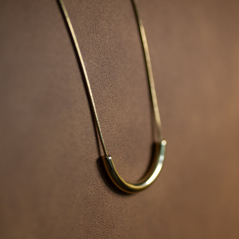 Clair de Lune gold crescent necklace on a 14k plated snake chain