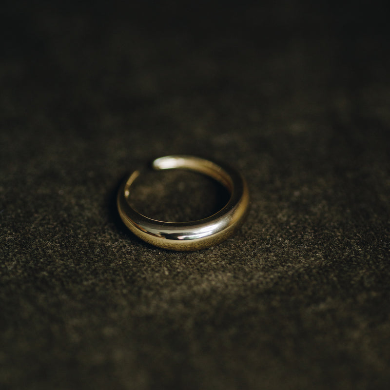 Erika ring – 14k gold plated sterling silver band on dark textured background