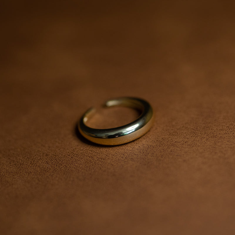 Erika ring – 14k gold plated sterling silver band on dark textured background