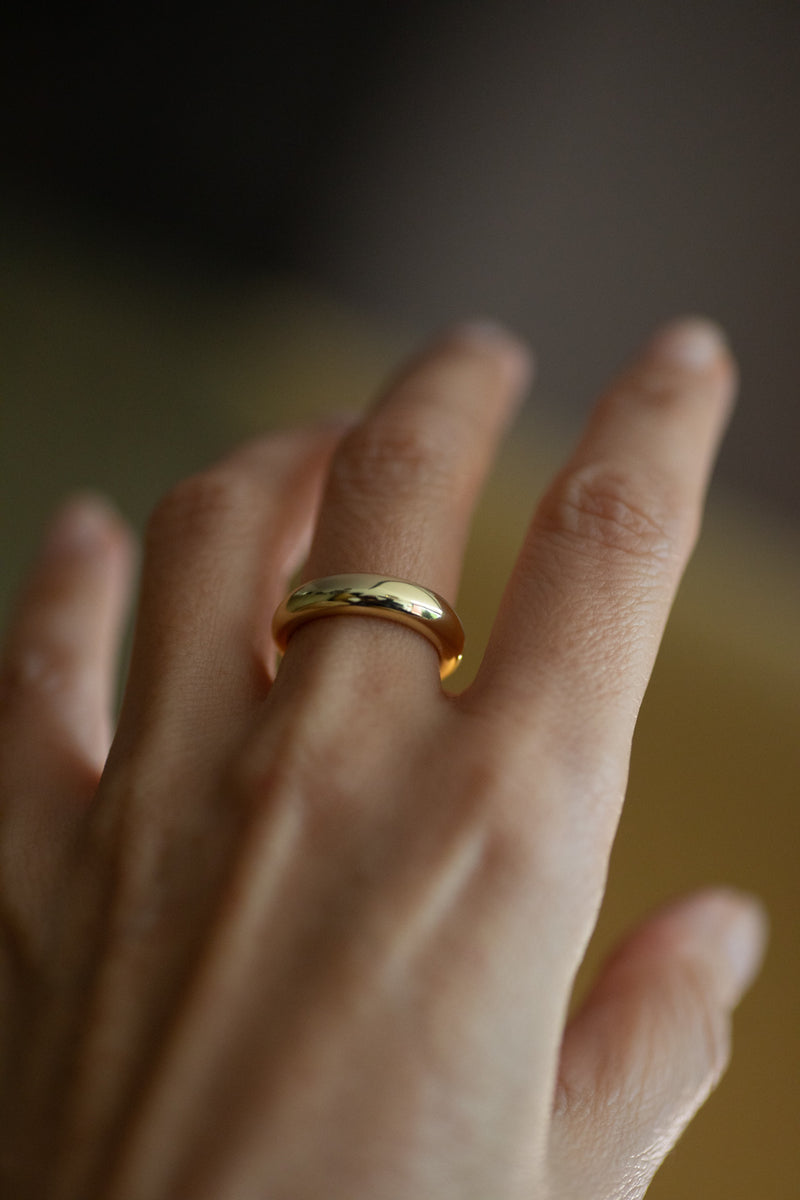 Erika ring – 14k gold plated sterling silver band on dark textured background